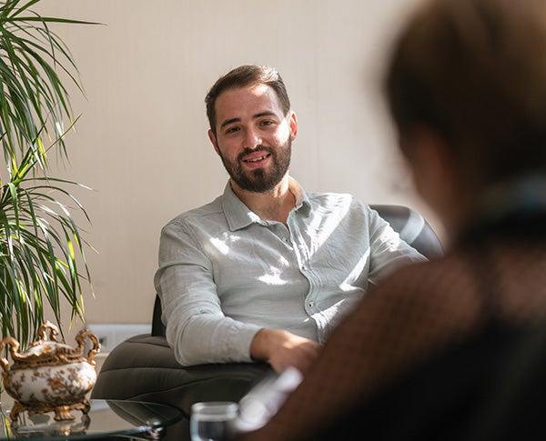 A middle-eastern male counsellor in session with his client.