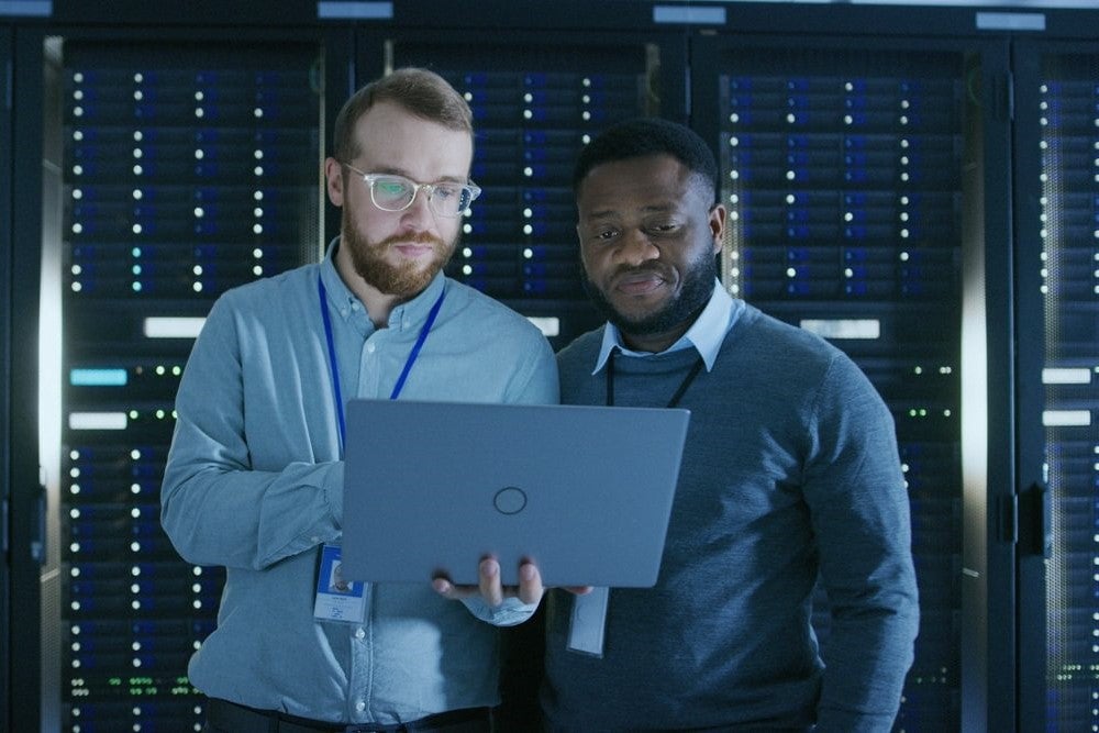 Two cyber security experts working together