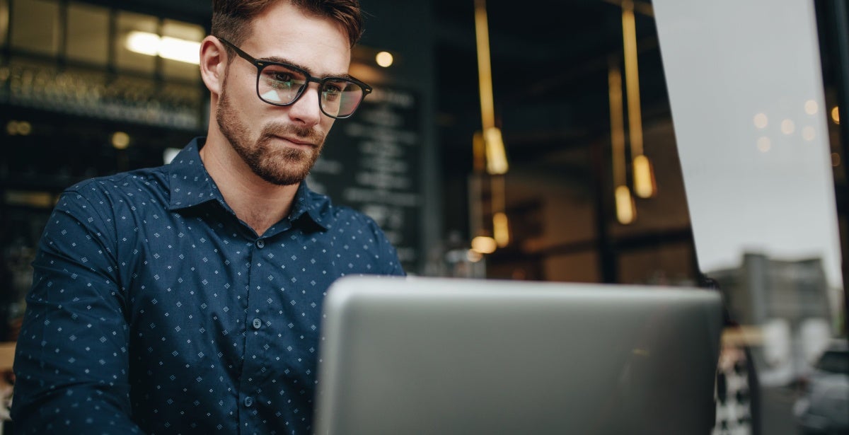 A finance expert working on his laptop