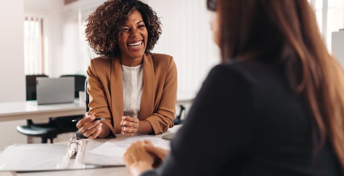 A CFO working and interacting with a colleague