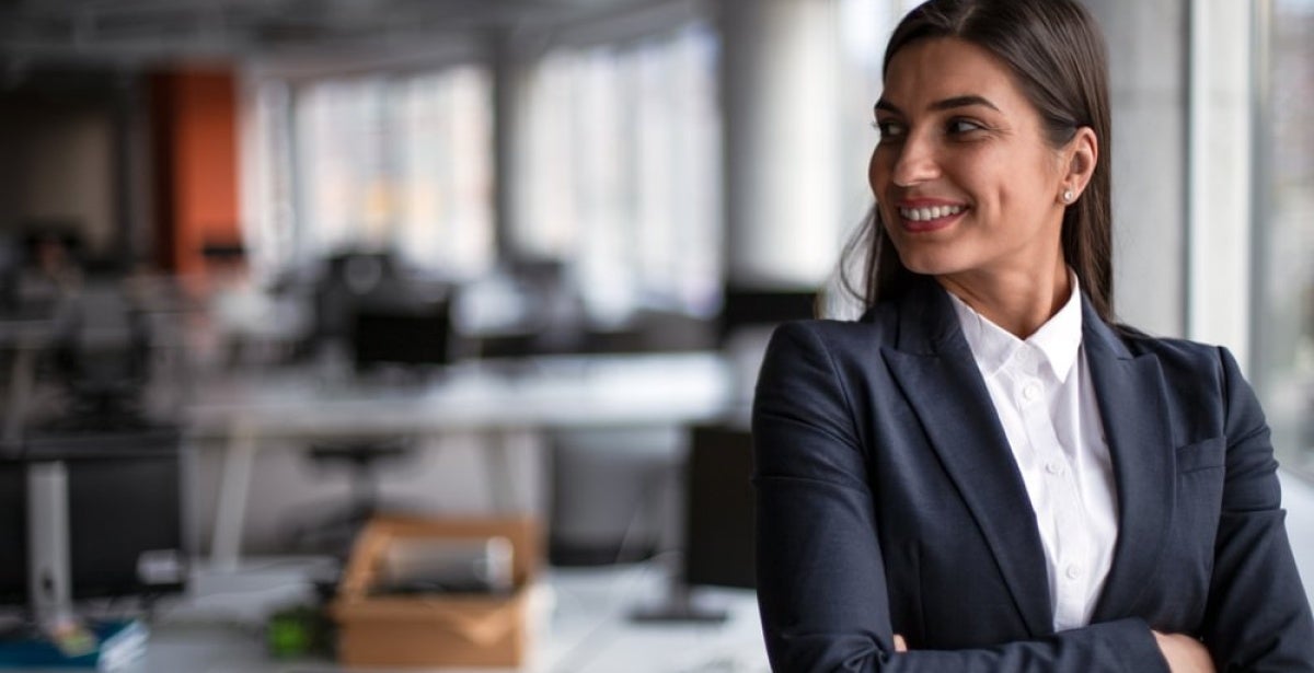 A smiling CFO with her arms crossed.