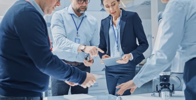 A group of data scientists and data analyts in a discussion at work