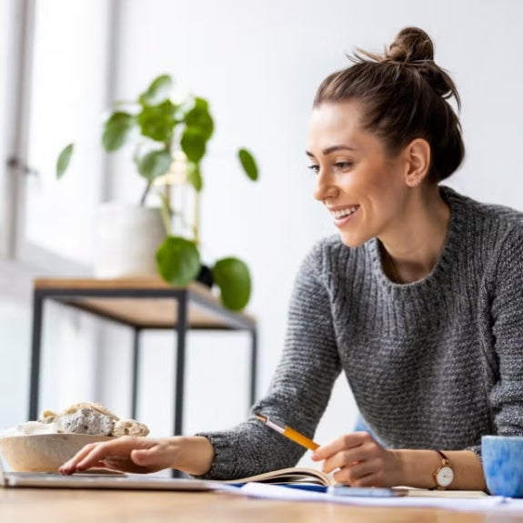 A fintech professional working on her laptop