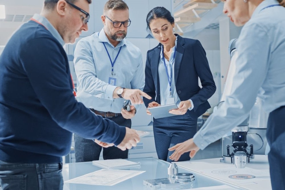 A group of data scientists and data analysts in a discussion at work.